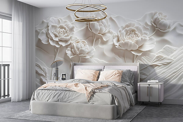 Sculpture de fleurs blanches sur un mur Sculpture de fleurs blanches sur un mur