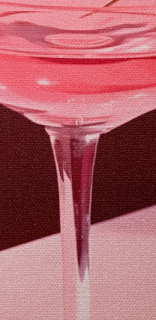 Verre avec un liquide rose et deux cerises dessus Verre avec un liquide rose et deux cerises dessus