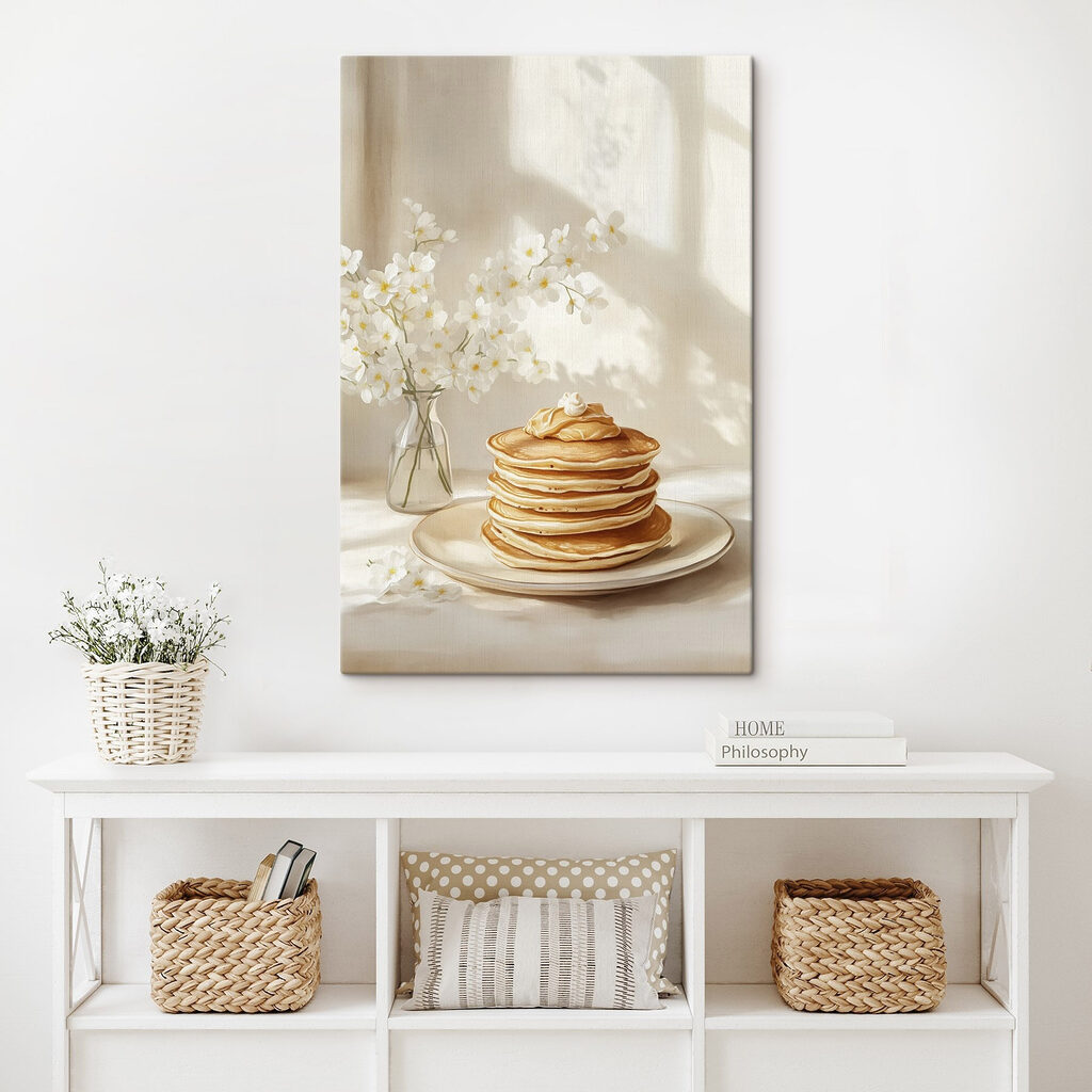 Stack of pancakes on a plate next to a vase of flowers