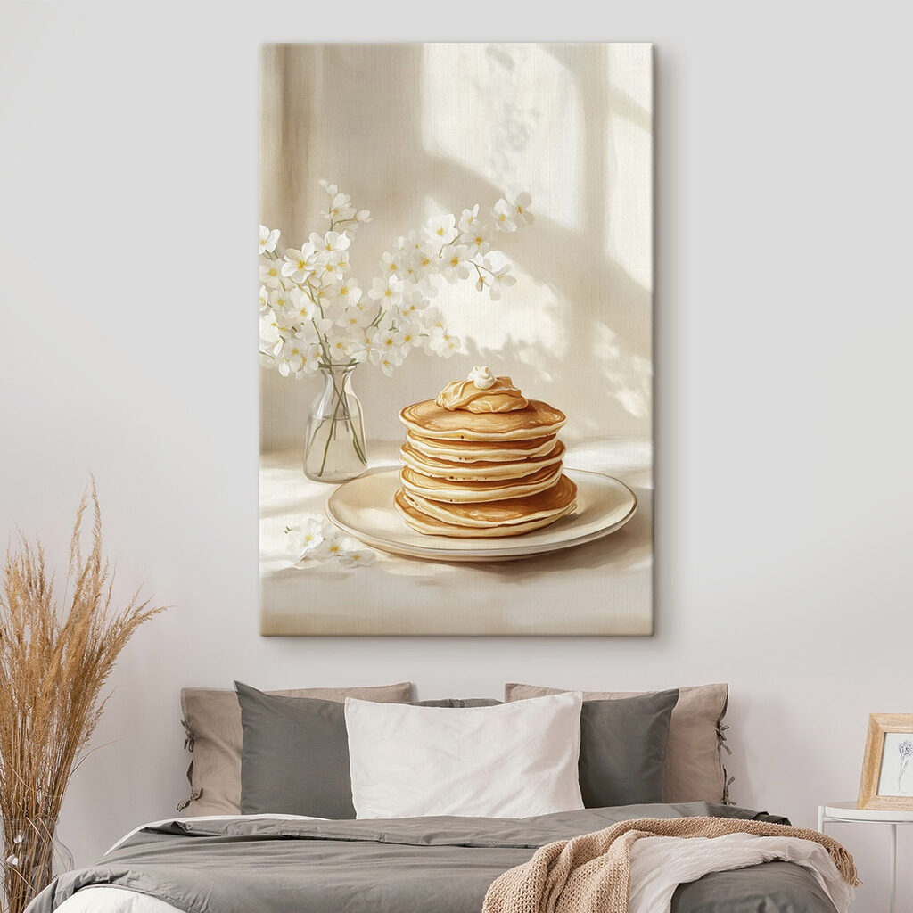 Stack of pancakes on a plate next to a vase of flowers
