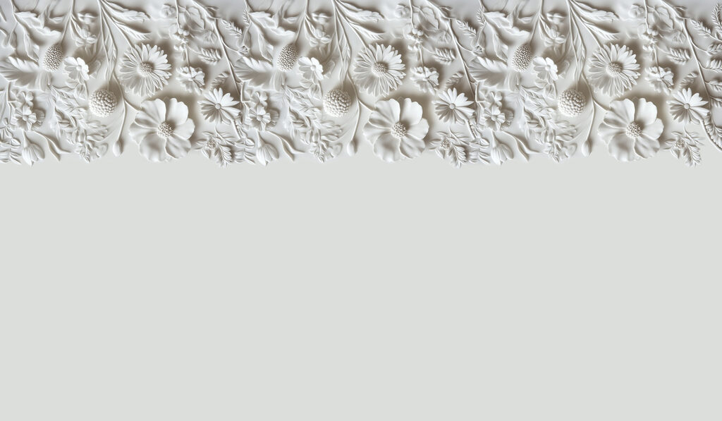 Motif floral blanc sur un mur Motif floral blanc sur un mur