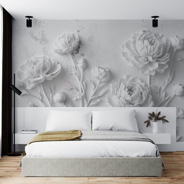 Sculpture de fleurs blanches sur un mur Sculpture de fleurs blanches sur un mur