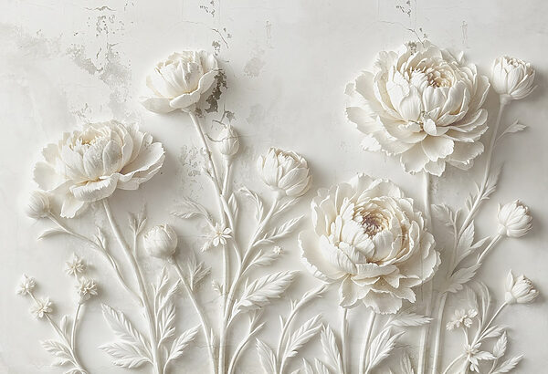 Sculpture de fleurs blanches sur un mur Sculpture de fleurs blanches sur un mur