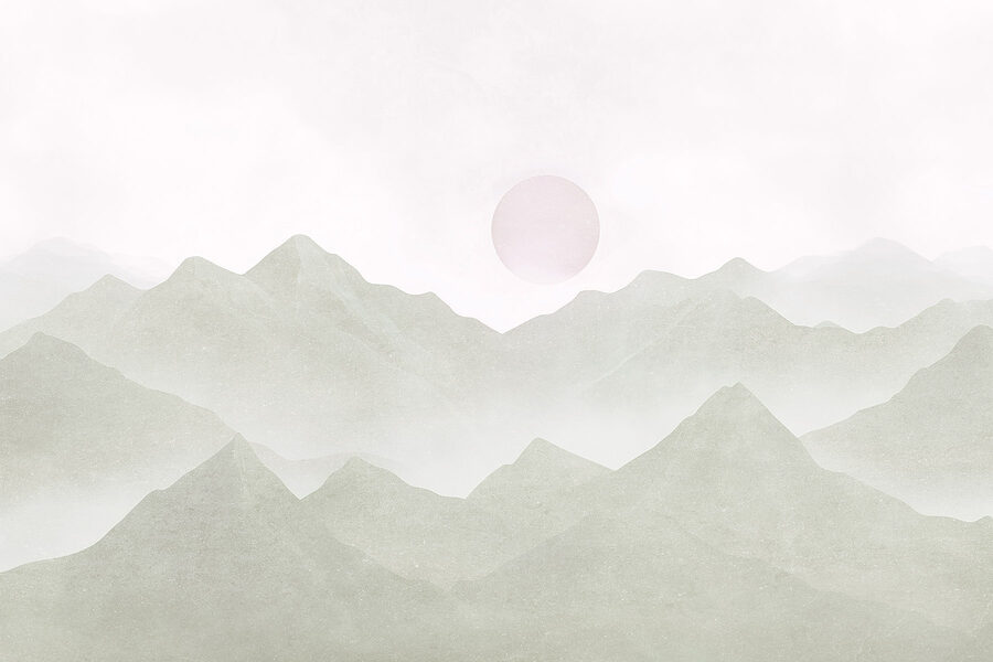 Chaîne de montagnes avec un soleil au loin