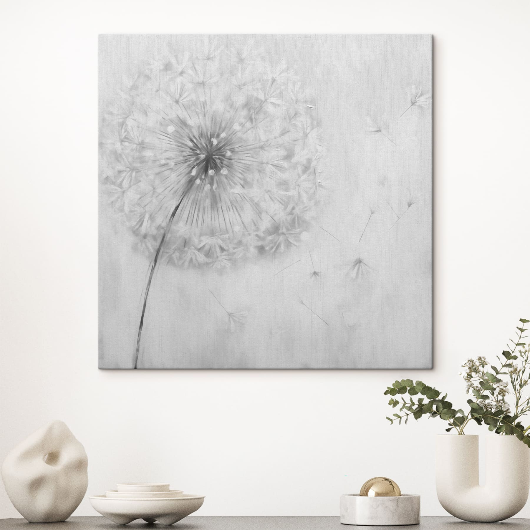Dandelion flower with seeds flying in the air