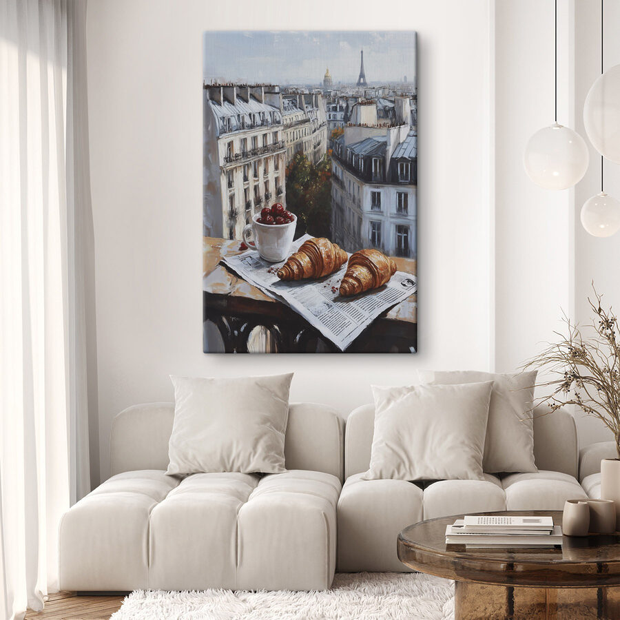Tasse de café et croissants sur une table avec des bâtiments en arrière-plan