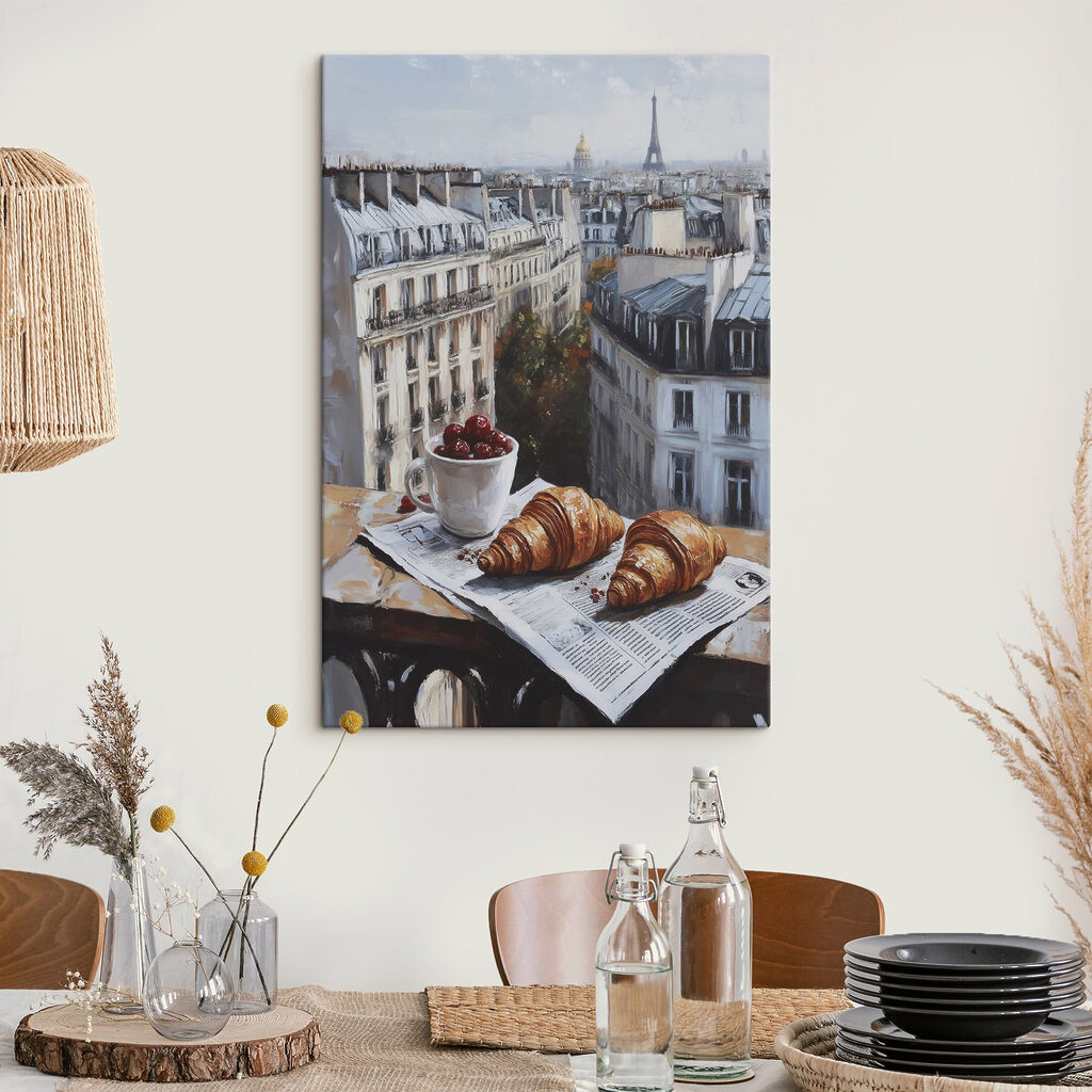 Cup of coffee and croissants on a table with buildings in the background