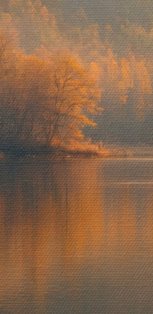 Lake with trees and mountains in the background