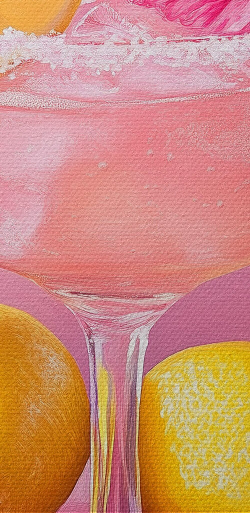 Glass with pink drink and lemons