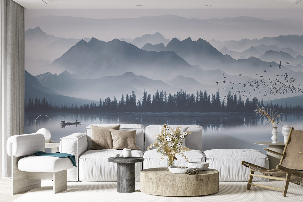 Person in a boat on a lake with mountains in the background