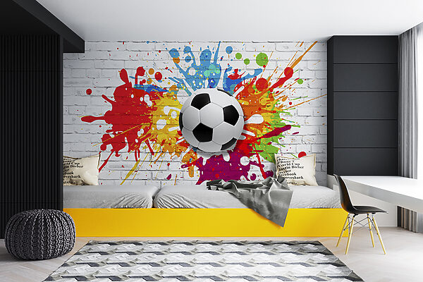 Ballon de football sur un mur de briques Ballon de football sur un mur de briques
