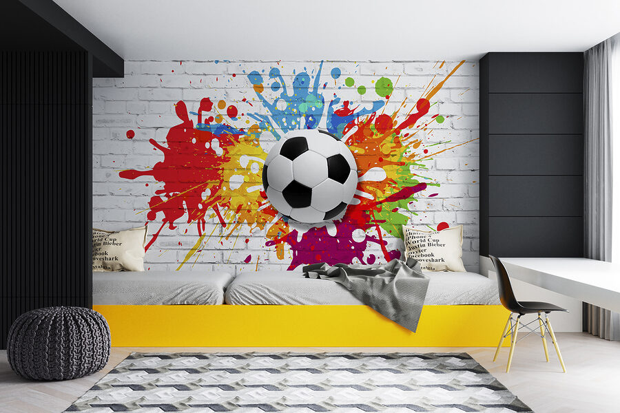 Ballon de football sur un mur de briques