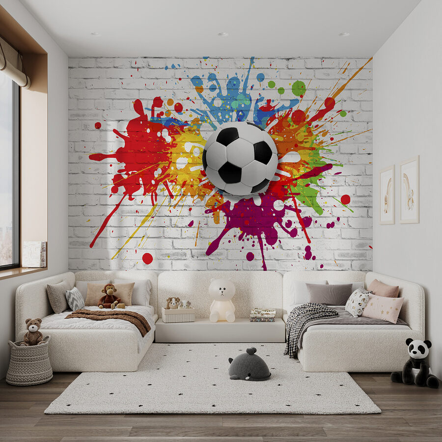Ballon de football sur un mur de briques