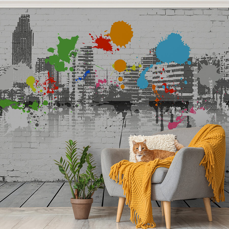 Mur de briques blanches avec des éclaboussures de peinture colorée