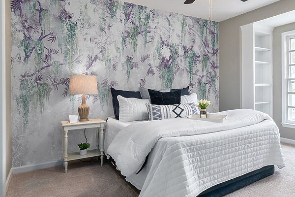 A tree branch with purple flowers