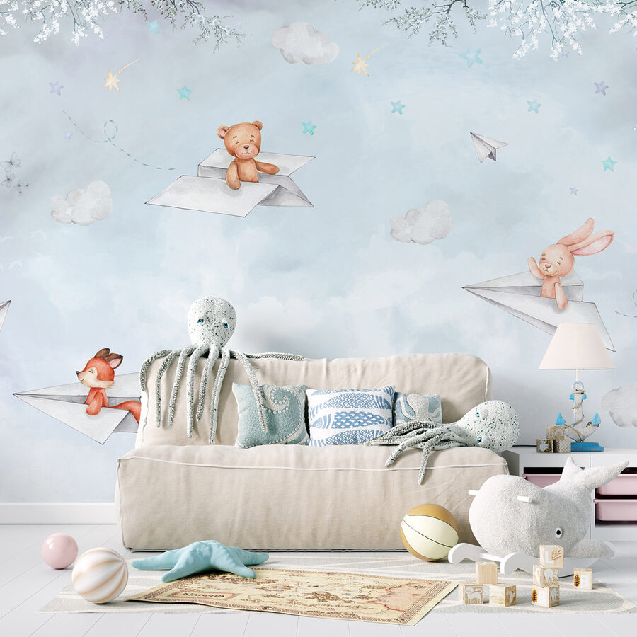 Un avion en papier et des ours en peluche