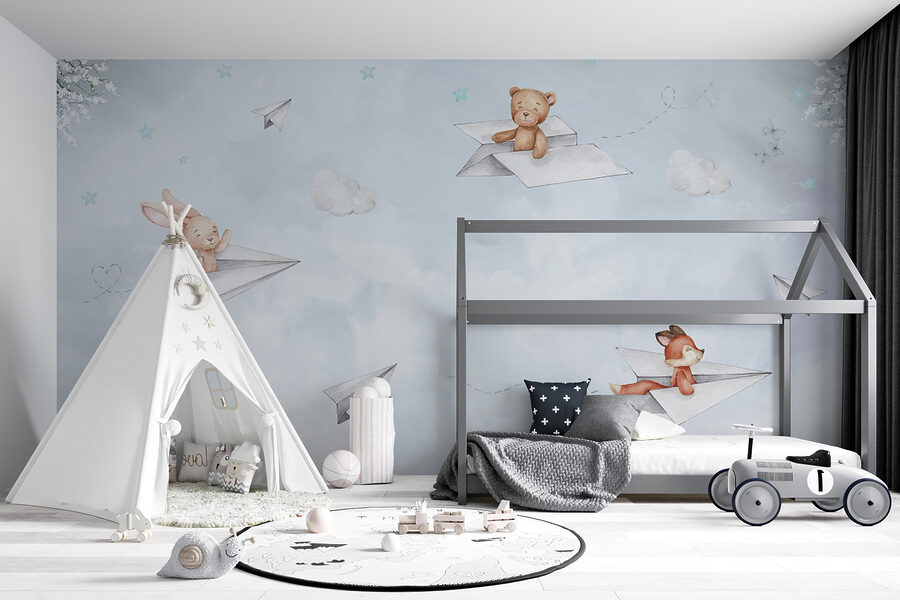 Un avion en papier et des ours en peluche