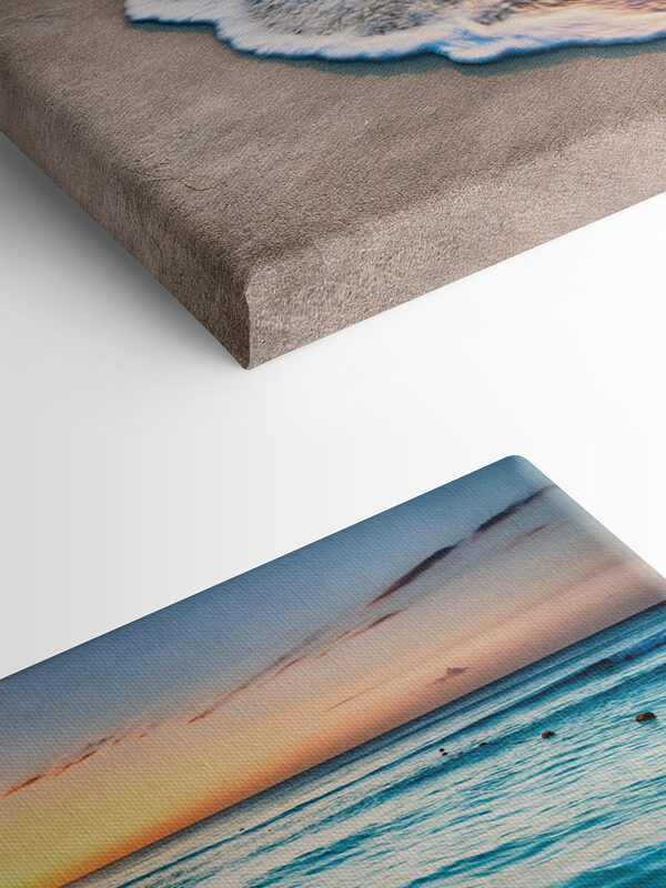 A beach with waves and a sunset