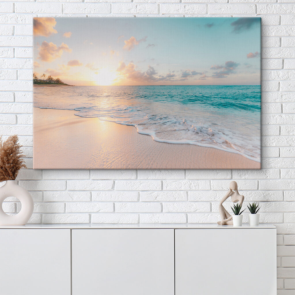 A beach with waves and a sunset