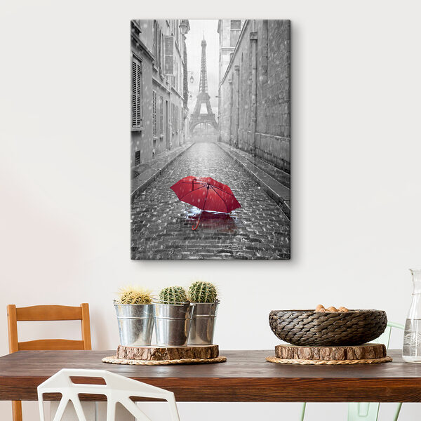 Un parapluie rouge dans une rue avec une tour en arrière-plan Un parapluie rouge dans une rue avec une tour en arrière-plan