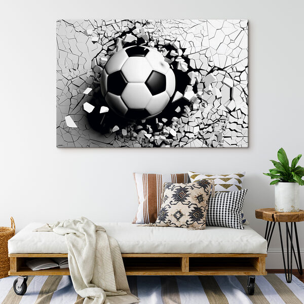 Un ballon de football qui traverse un mur Un ballon de football qui traverse un mur