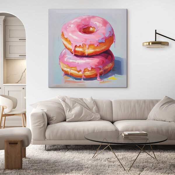 Deux beignets avec un glaçage rose Deux beignets avec un glaçage rose
