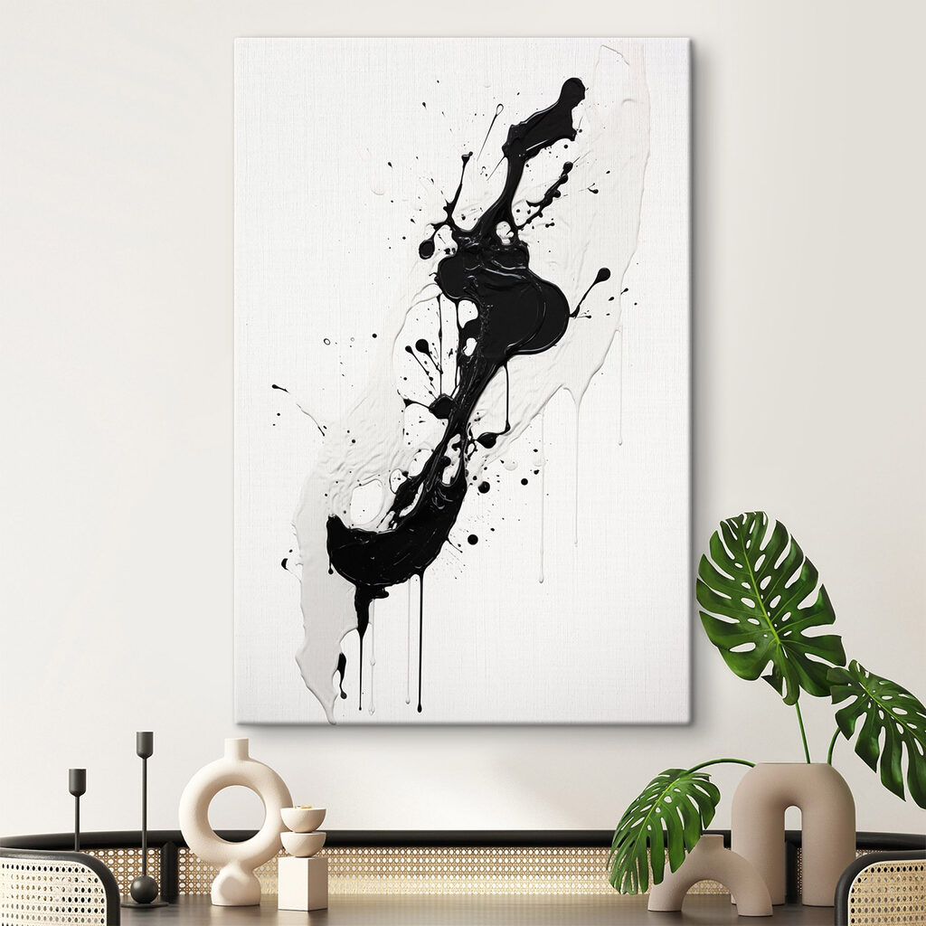 Black and white paint splattered on a white surface
