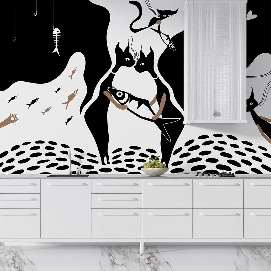 Chat noir et blanc avec poisson et poisson