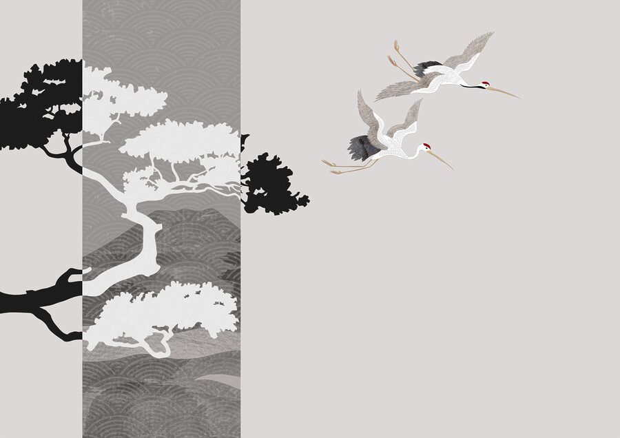 Couple de grues volant près d'un arbre