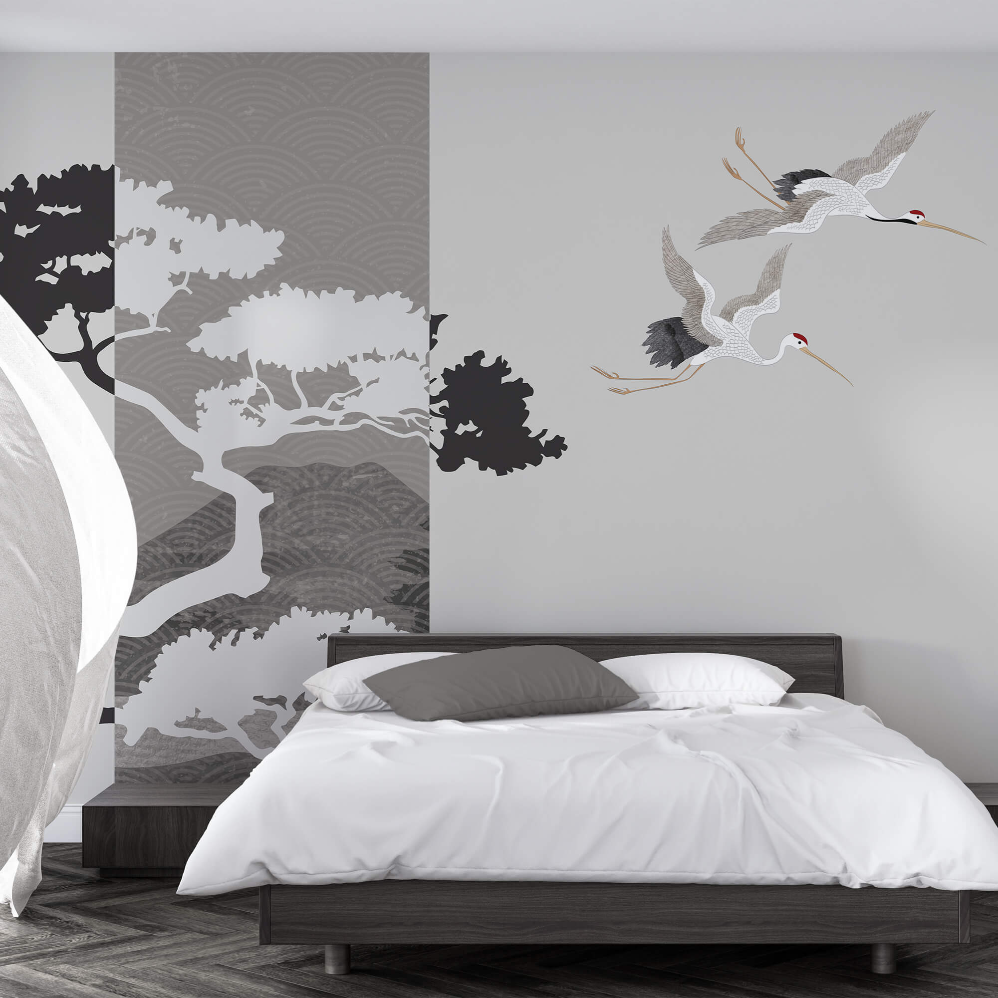 Couple de grues volant près d'un arbre