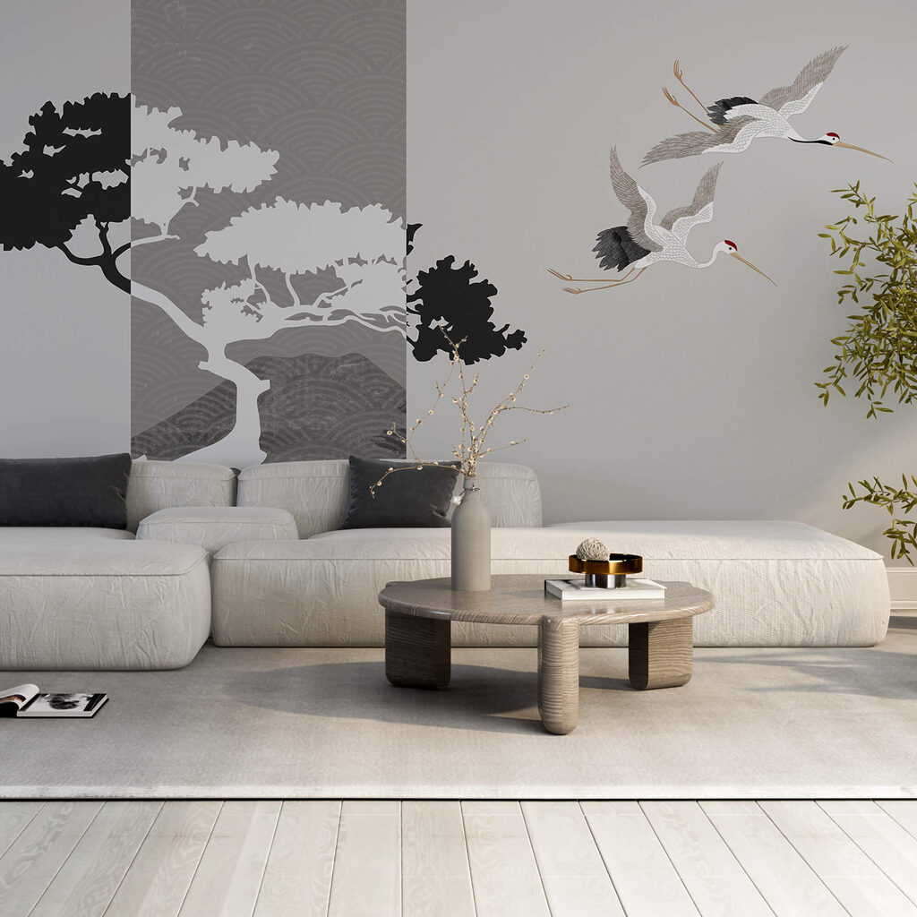 Couple de grues volant près d'un arbre