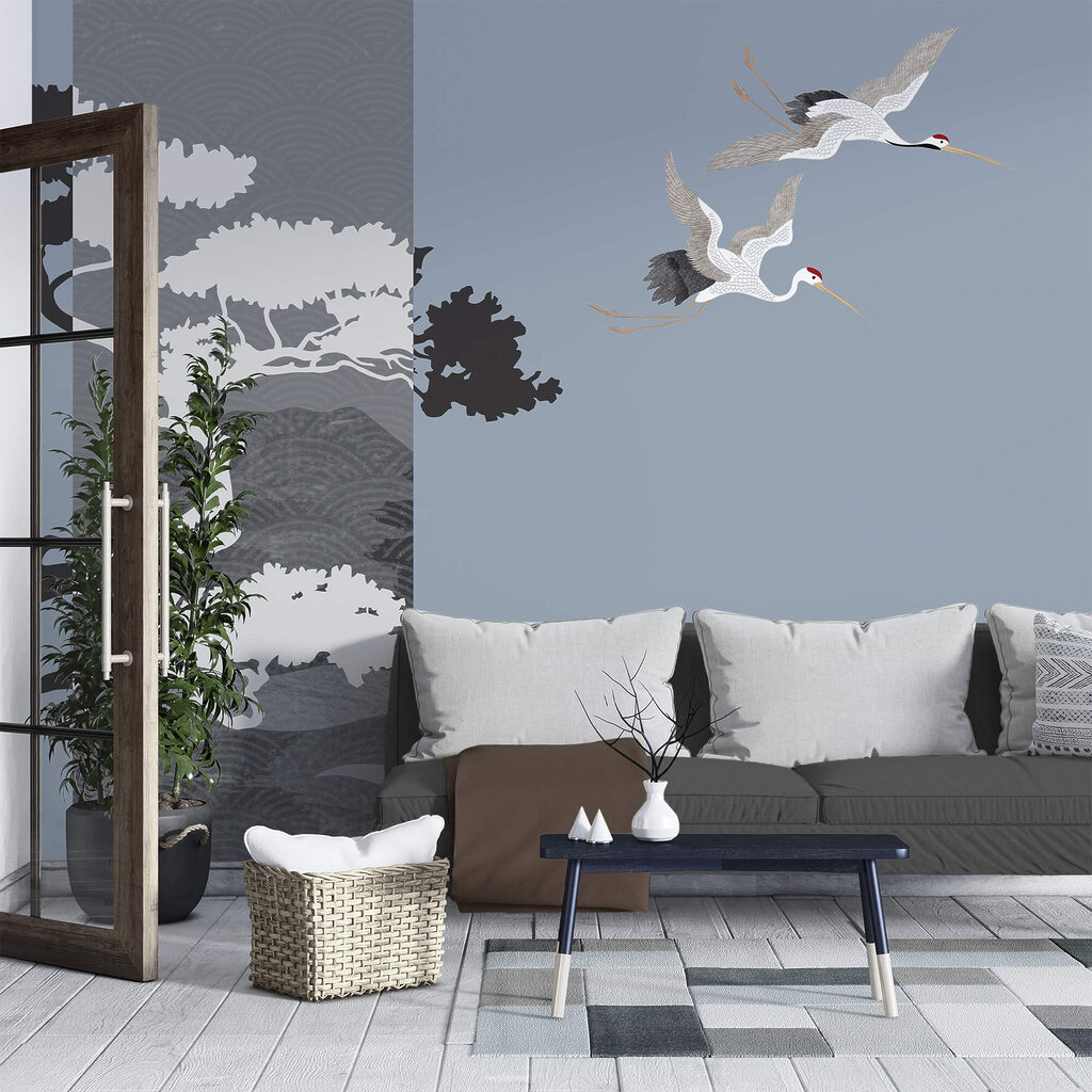 Couple de grues volant près d'un arbre Couple de grues volant près d'un arbre