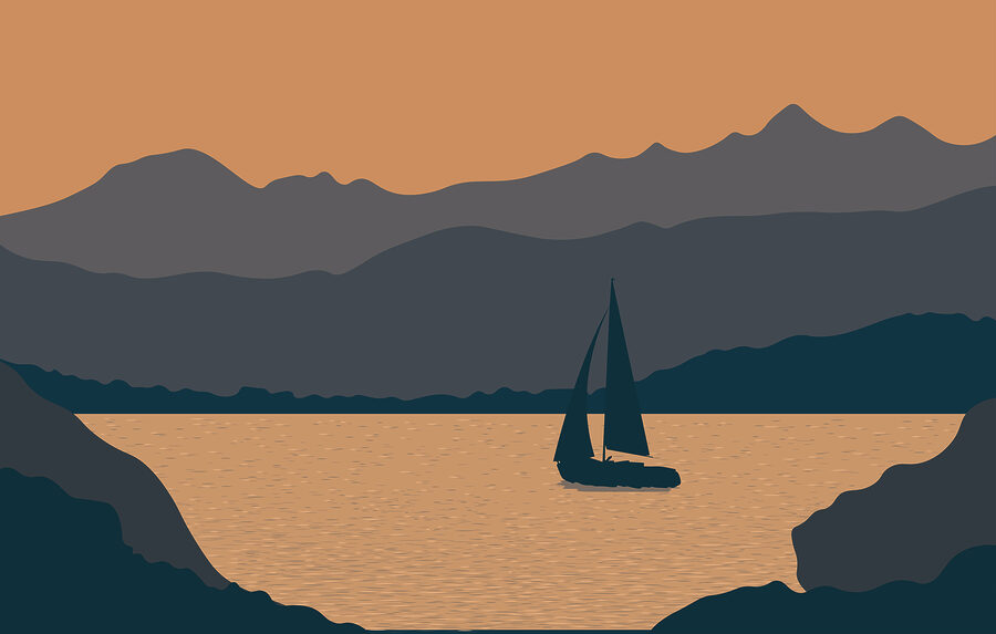 Voilier sur l'eau avec des montagnes en arrière-plan