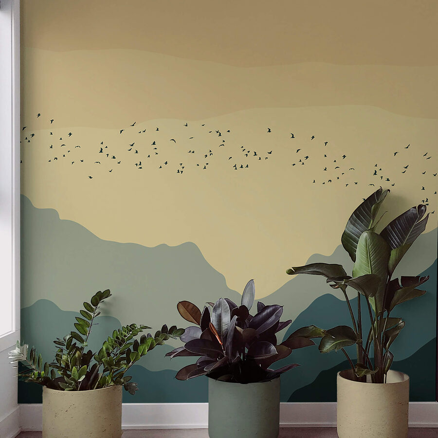 Peintures murales Groupe d'oiseaux volant au-dessus des montagnes