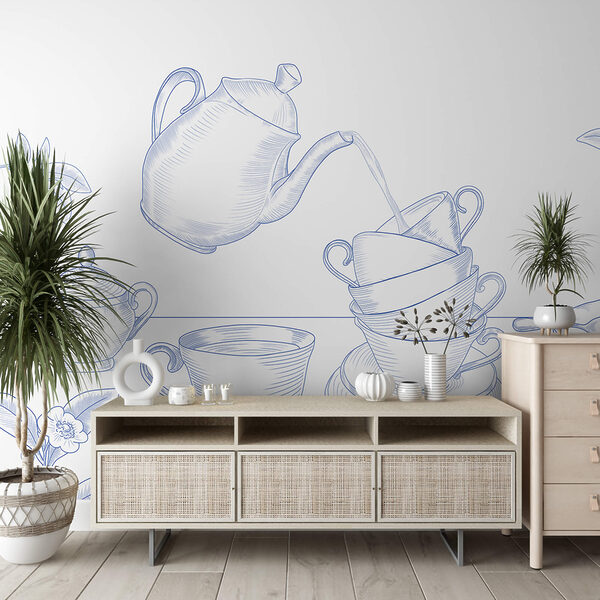 Théière versant dans une pile de tasses à thé Théière versant dans une pile de tasses à thé