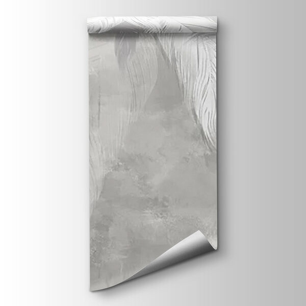 White feather on a grey surface