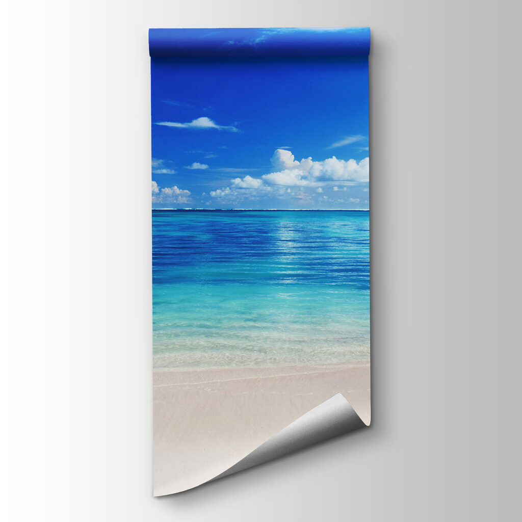 Beach with blue water and clouds