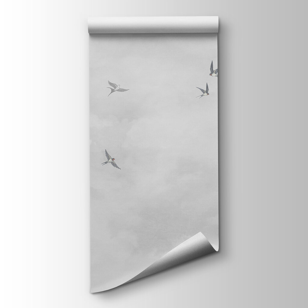 A group of birds flying in the sky