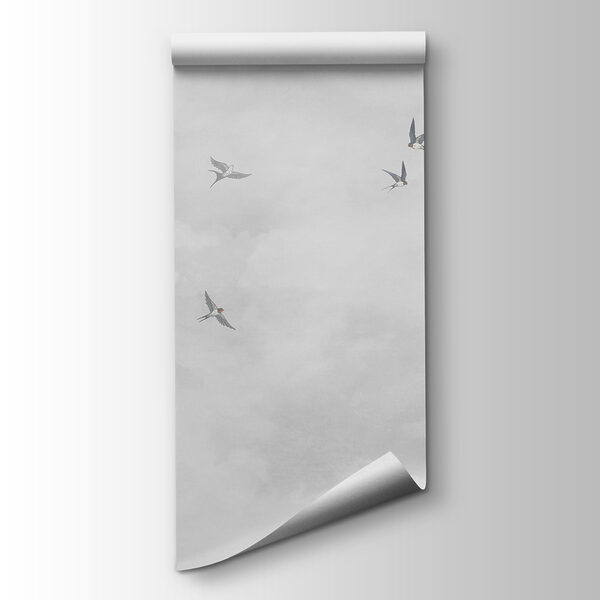 A group of birds flying in the sky