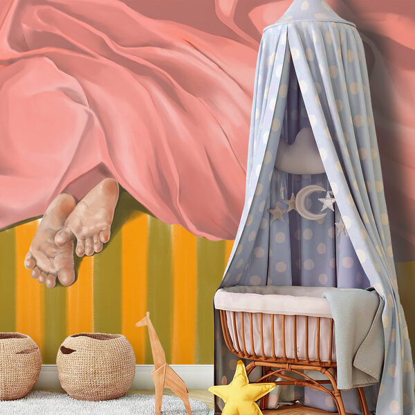 Paire de pieds sous une couverture rose