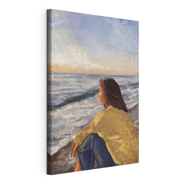 Tableaux Une femme assise sur une plage regardant l'océan