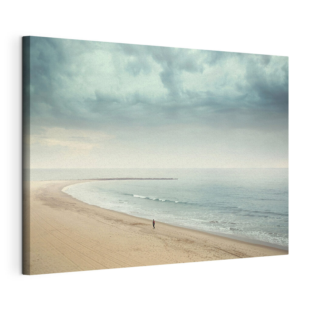 A person walking on a beach
