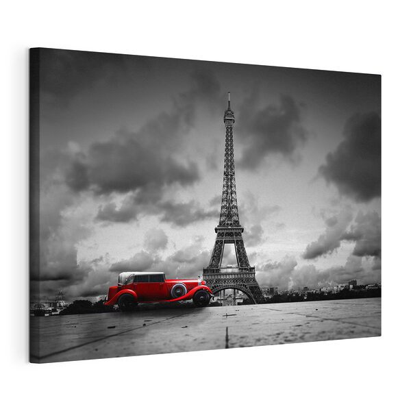 Une voiture rouge garée devant une grande tour Tableaux Une voiture rouge garée devant une grande tour
