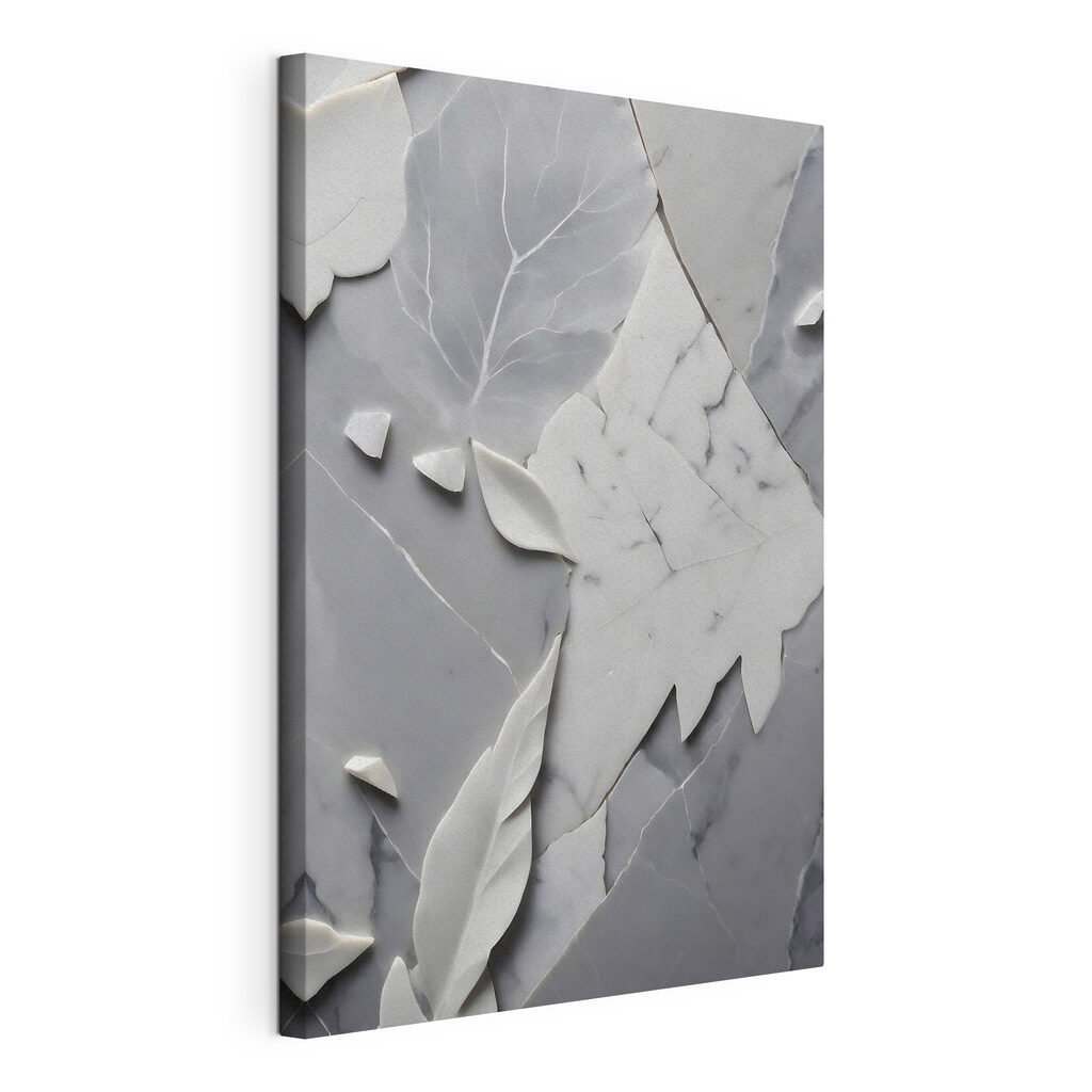A white and gray marble surface with leaves