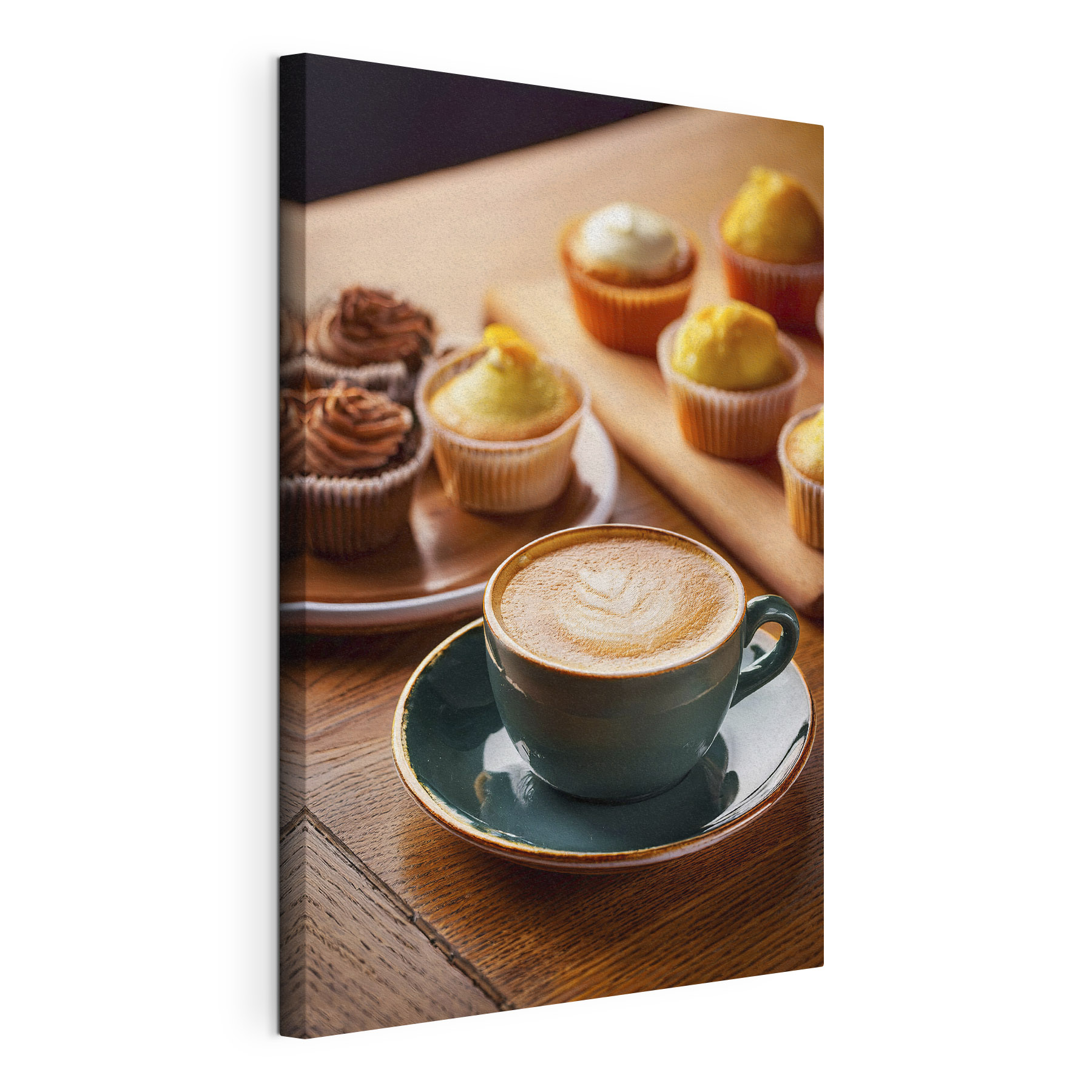 Cup of coffee and cupcakes on a table