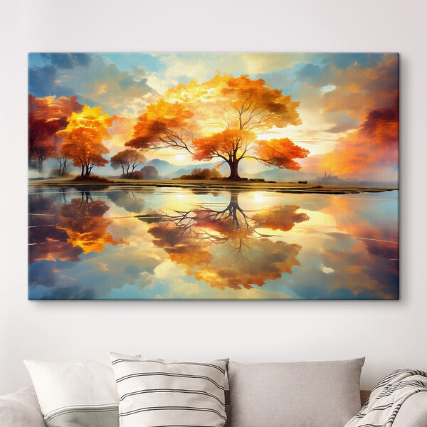 Tree with yellow leaves on the ground and a body of water Tree with yellow leaves on the ground and a body of water