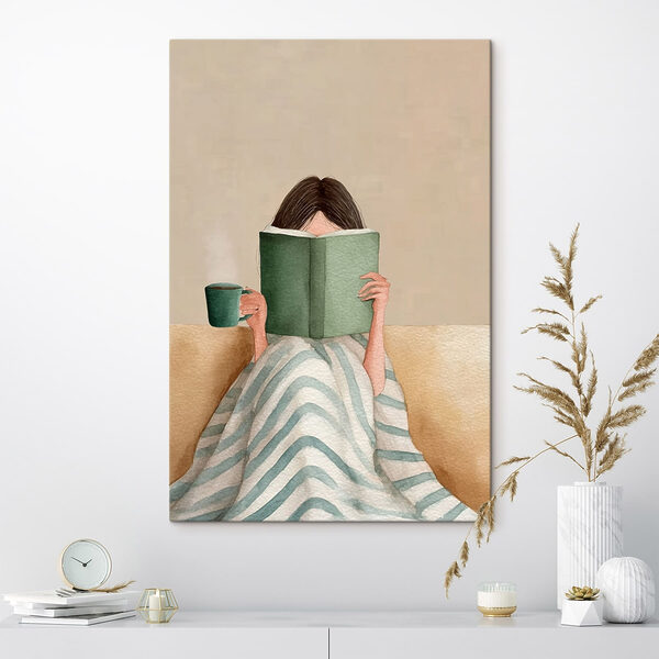 Woman reading a book and holding a cup