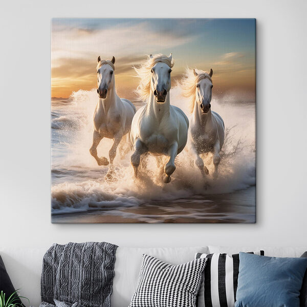 Group of white horses running on a beach Group of white horses running on a beach